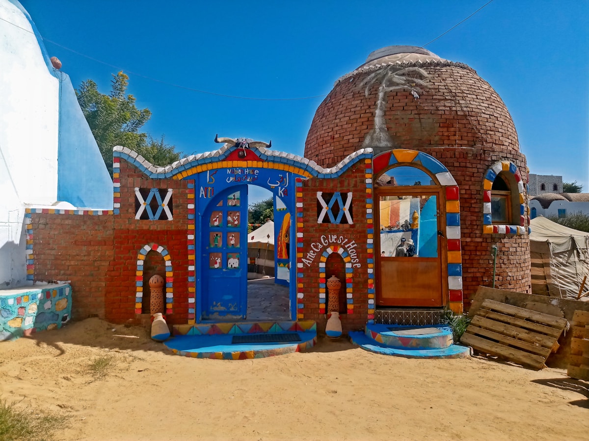 Colourful painted Nubian guesthouse with domed roof in Gharb Soheil, Aswan