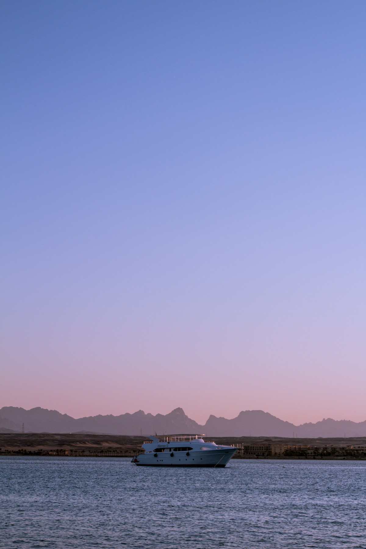 The Blue Hole dive site with turquoise water and rugged Sinai mountains behind Dahab