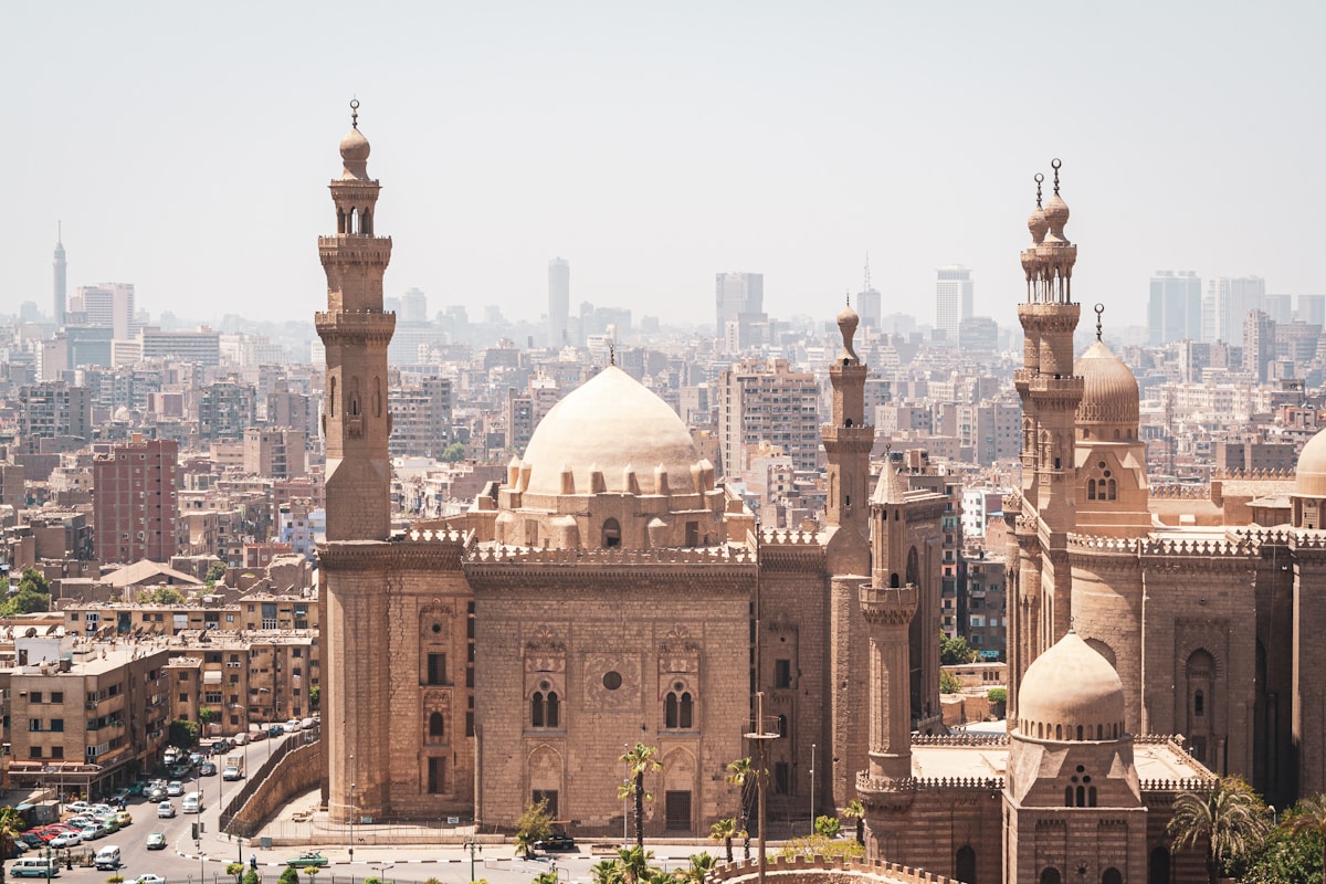 Cairo skyline with mosque domes and minarets, the city sprawling behind