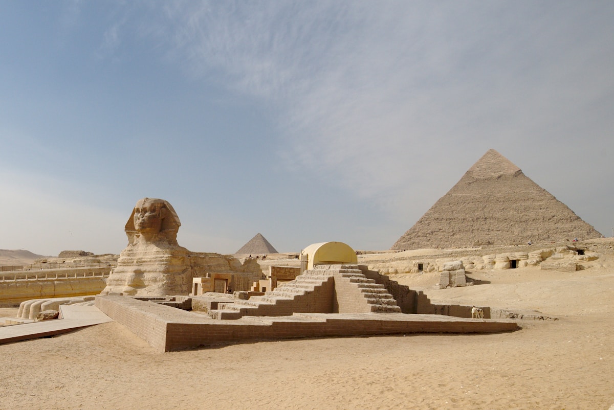The Great Sphinx and Pyramids of Giza at sunrise in Egypt