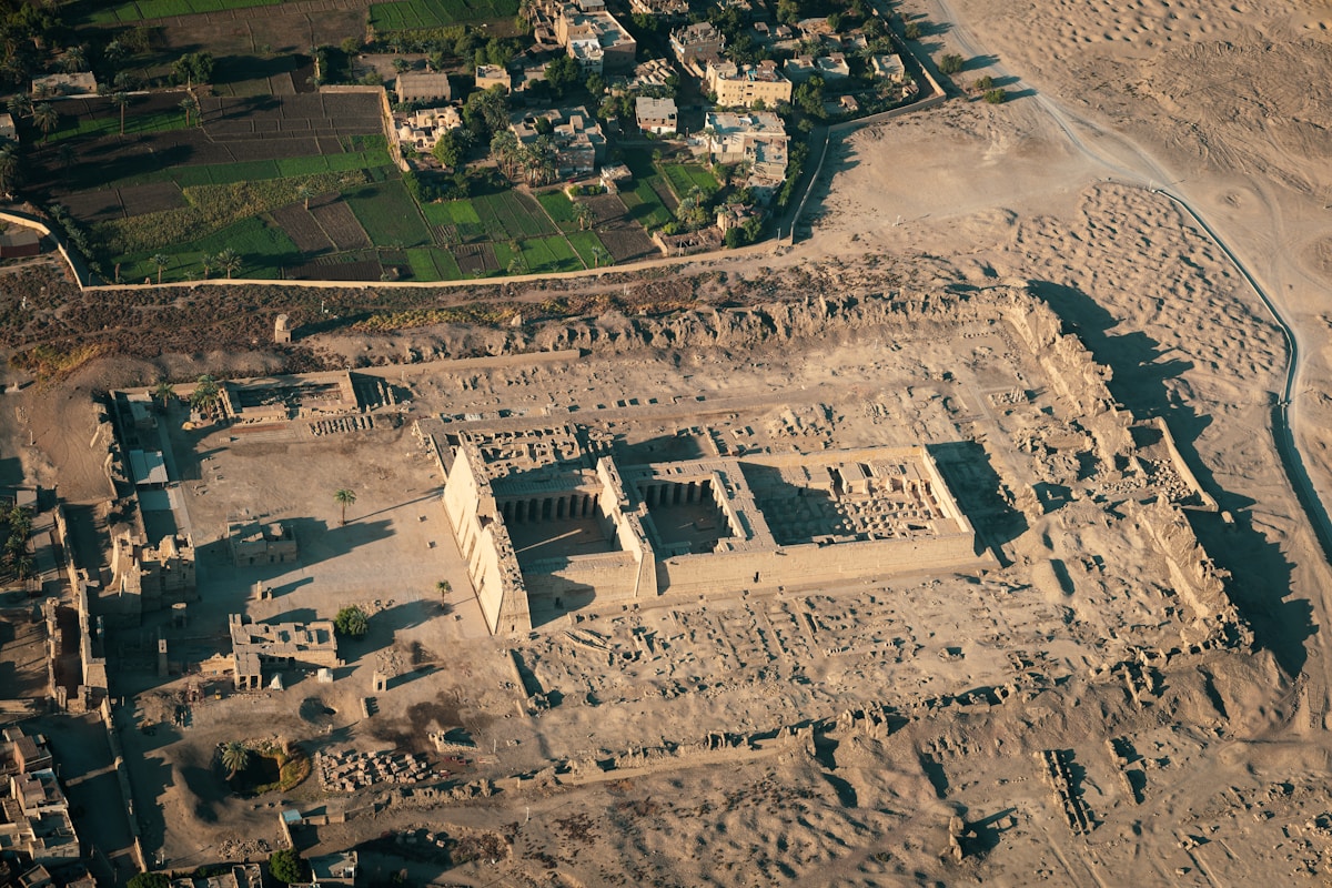 Luxor Temple illuminated at night with the Avenue of Sphinxes in the foreground