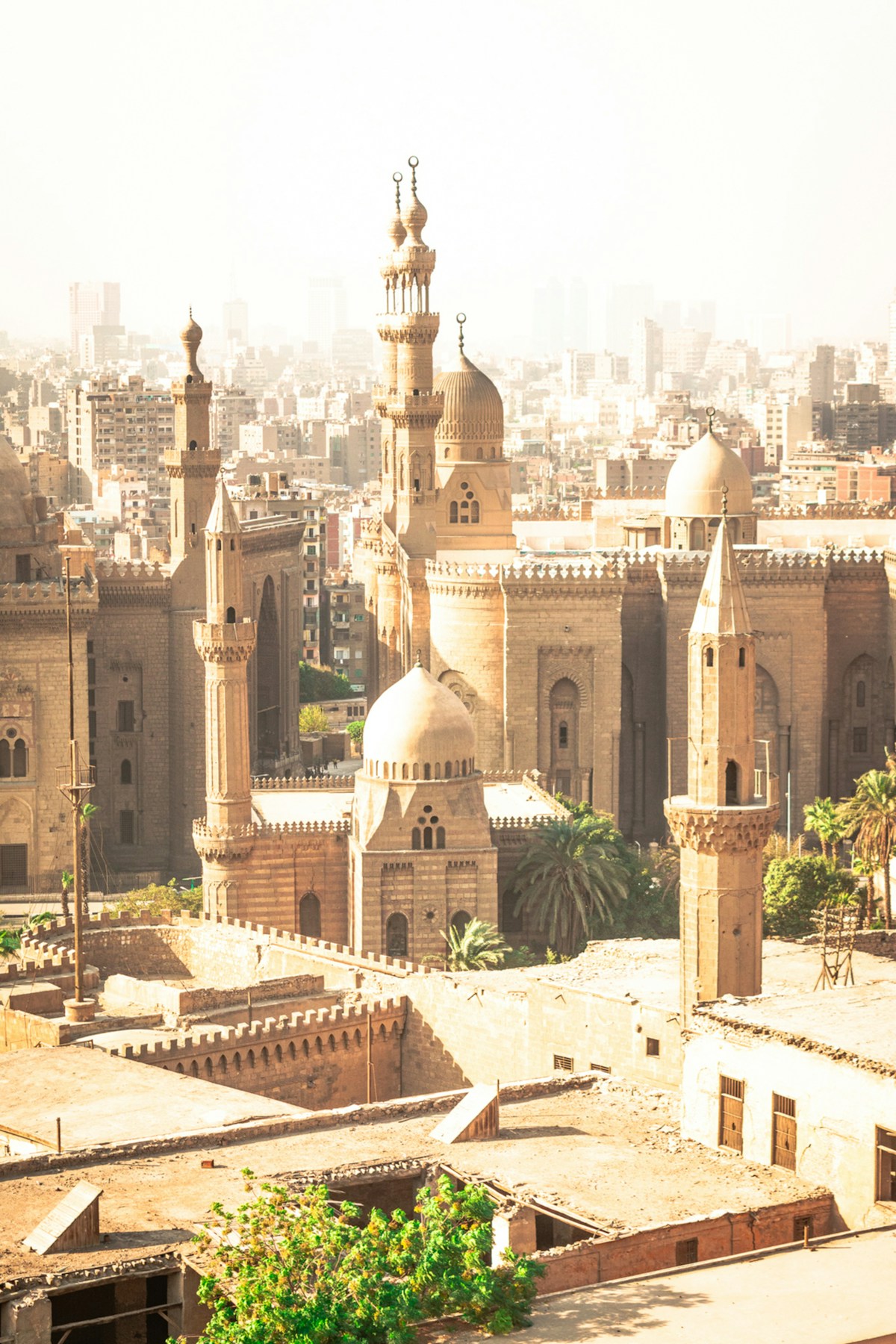 Domes and minarets of the Al-Rifai and Sultan Hassan mosques against the Cairo skyline