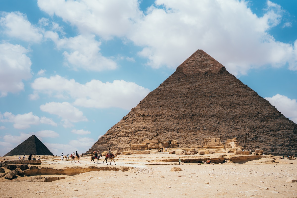 The Pyramids of Giza at dawn with the Sphinx in the foreground