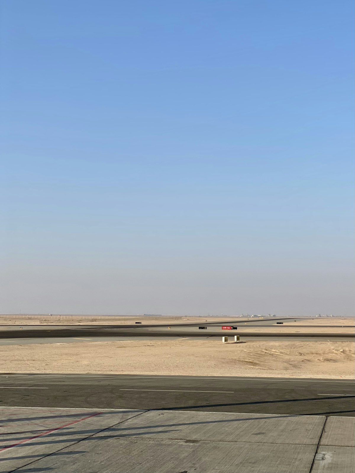 Airport runway in Egypt under a clear desert sky