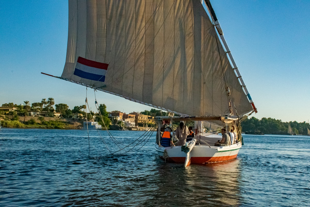 Traditional sailboat under sail on the Nile near Aswan, Egypt