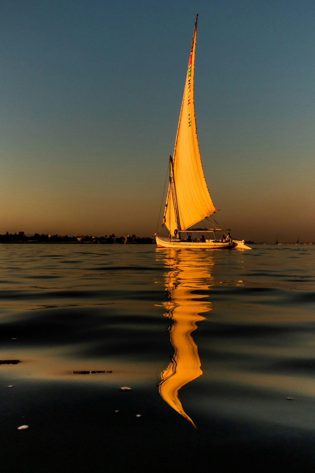 Felucca sailboat on the River Nile at sunset, Luxor