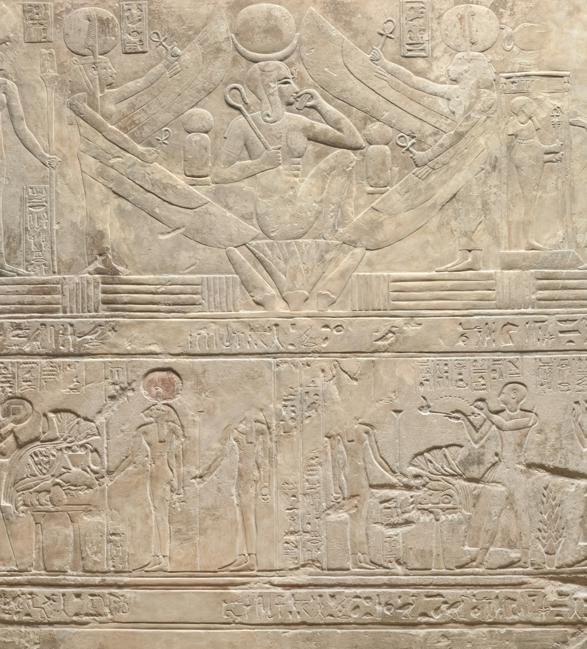 Ancient Egyptian hieroglyphic relief carving with gods and figures