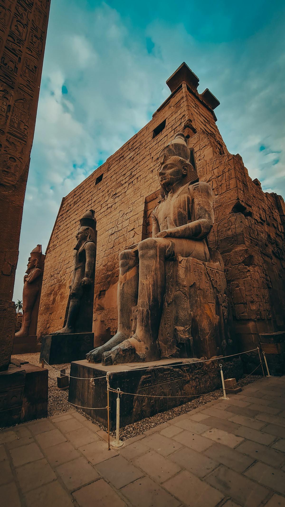 Ancient pharaoh statue at Luxor Temple gateway, Upper Egypt