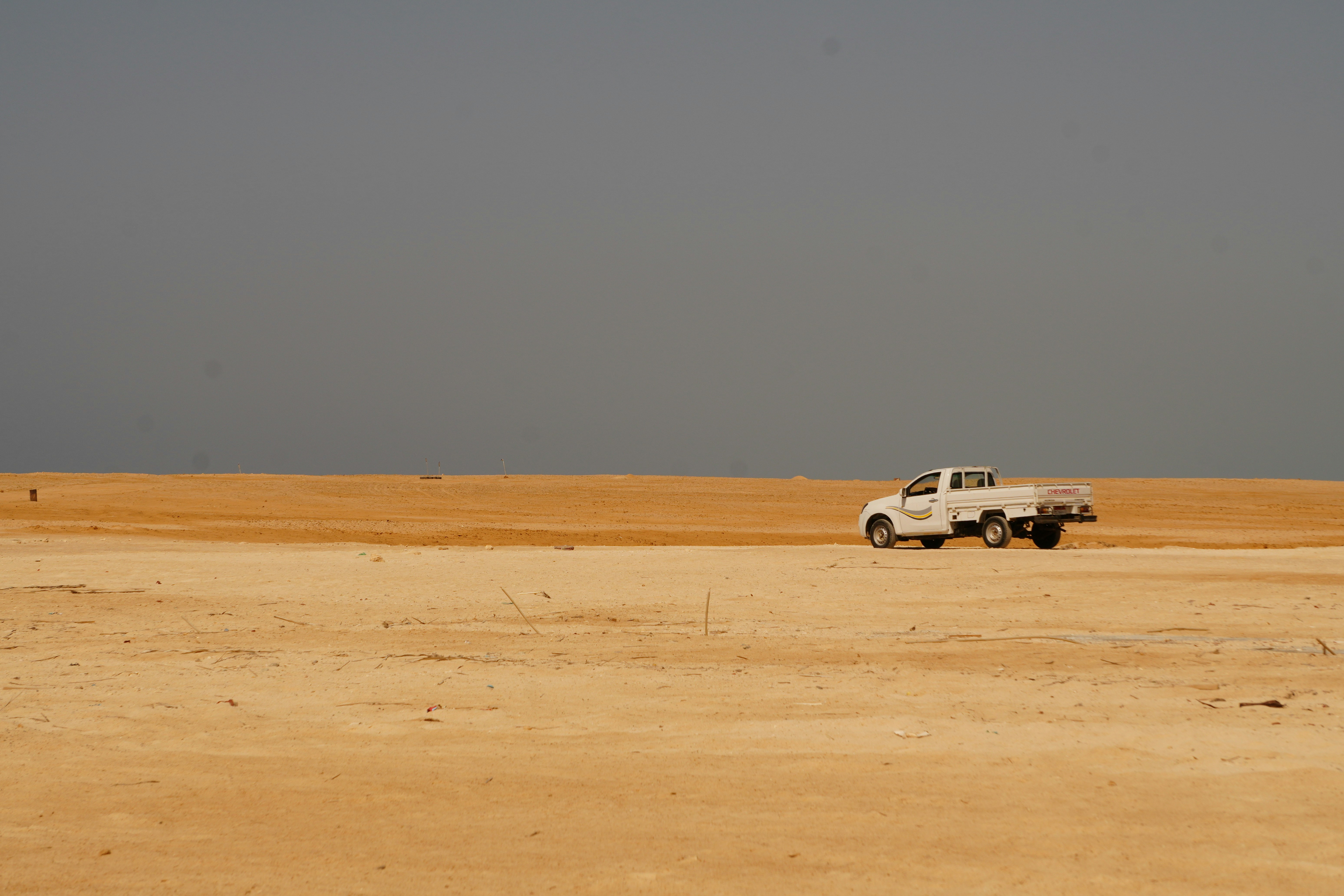 White pickup truck on the open desert highway near El Gouna, Egypt